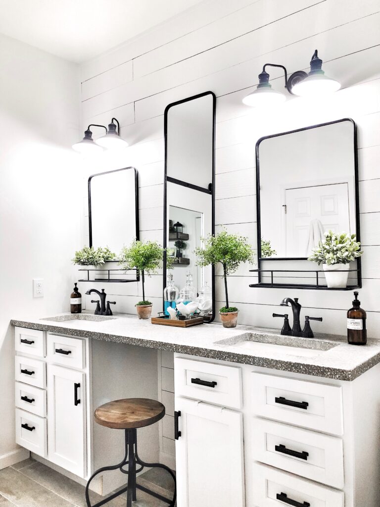 Bathroom vanity with mirrors and decorative storage